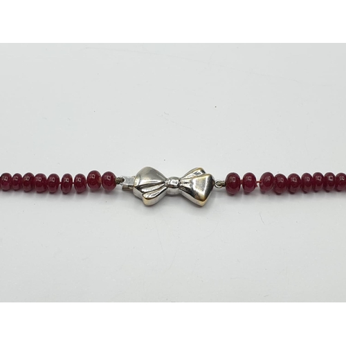 812 - Diamond and Ruby NECKLACE with 18ct gold clasp.   15.9g    40cm