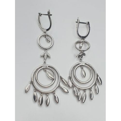 692 - Pair of 18ct white gold and diamond drop earrings in the shape of dream catchers, weight 15.82g and ... 