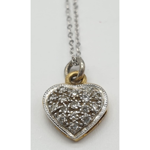 723 - 18ct gold diamond set heart shaped pendant set on 46cm long 9ct gold chain, weight 1.87g approx