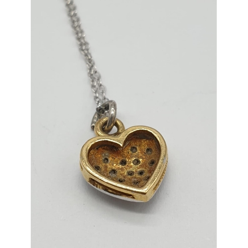 723 - 18ct gold diamond set heart shaped pendant set on 46cm long 9ct gold chain, weight 1.87g approx