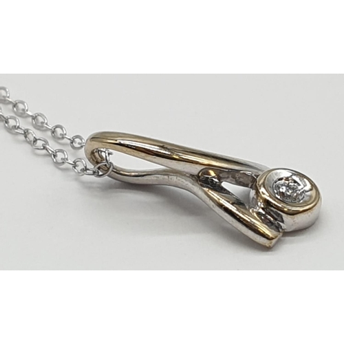 795 - 9ct white gold diamond set pendant set on 9ct gold 46cm long chain, weight 1g approx