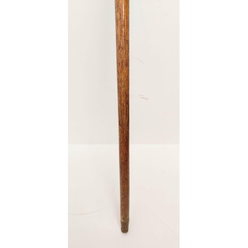 373 - Gentleman's antique walking stick, with brass studs on the holder and a brass tip-end, 88cm long