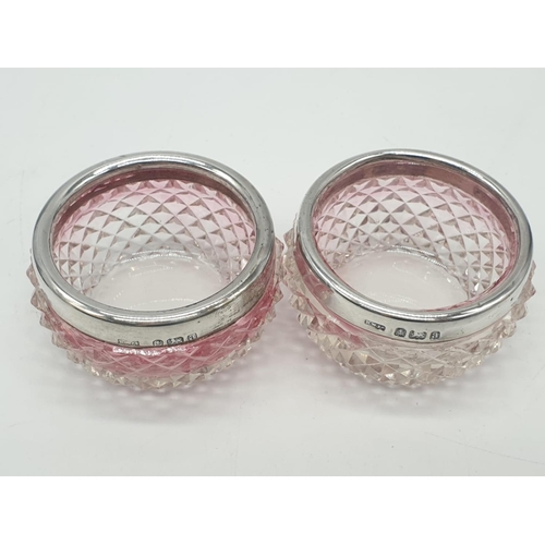 457 - 2x extraordinary rose tinted cut glass miniature pots topped with hallmarked silver collars, 6x3cm (... 