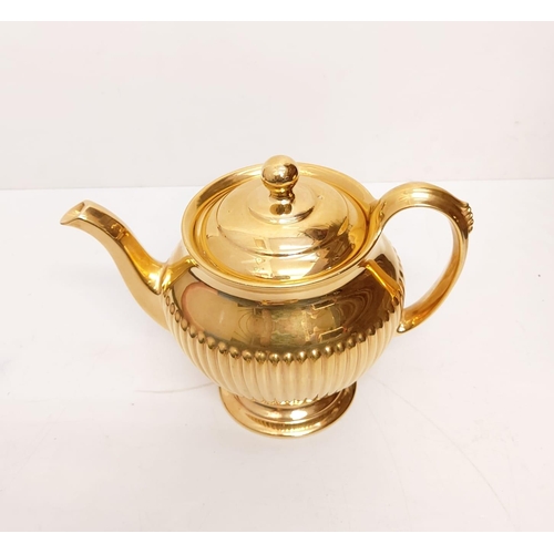 461 - Stunning Royal Winton Grimwads golden tea set including a ribbed teapot, milk jug and sugar bowl, te... 