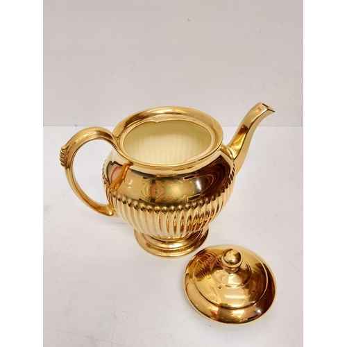 461 - Stunning Royal Winton Grimwads golden tea set including a ribbed teapot, milk jug and sugar bowl, te... 