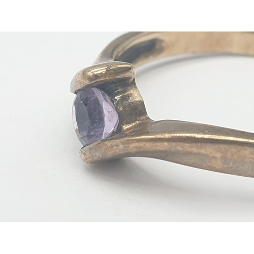 468 - 9ct gold cross over ring with amethyst stone, 2.2g weight and size Q