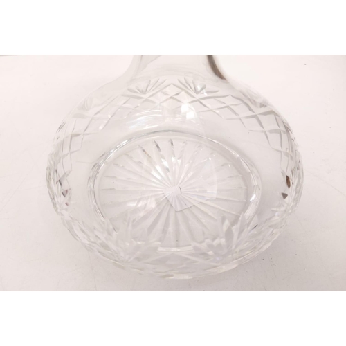 470 - A tastefully decorated cut glass decanter-possibly Wedgewood, 22cm tall