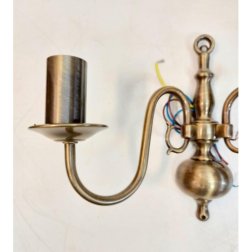 485 - A pair of gilded wall lights, with brass effect. Made by Franklite, unused - as new. 32 x 20cm.