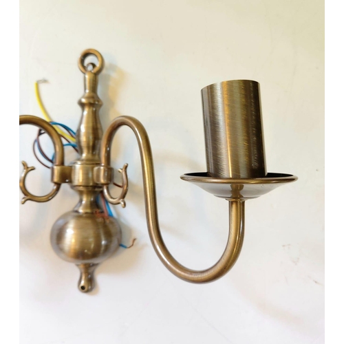 485 - A pair of gilded wall lights, with brass effect. Made by Franklite, unused - as new. 32 x 20cm.