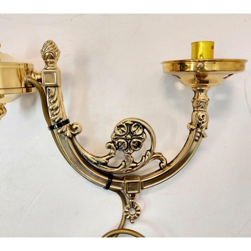 489 - A decorated gilded metal twin lamp with bras effect. Supplied with ceiling mount and twin chains. 54... 