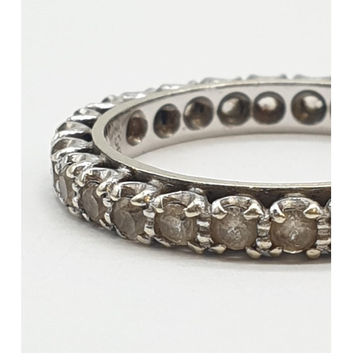 393 - 9ct white gold eternity ring. 3.2g, size P.