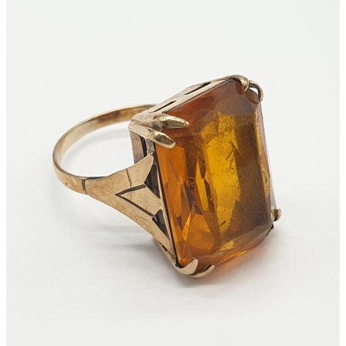 406 - 9ct gold and amber dress ring. 5.8g, size J/K