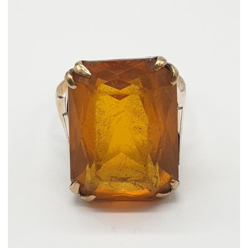 406 - 9ct gold and amber dress ring. 5.8g, size J/K