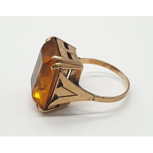 406 - 9ct gold and amber dress ring. 5.8g, size J/K