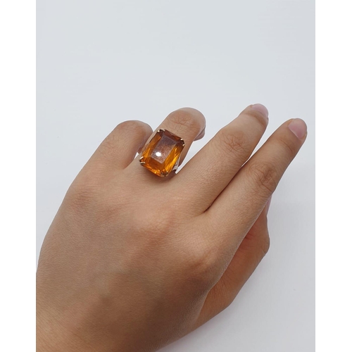 406 - 9ct gold and amber dress ring. 5.8g, size J/K