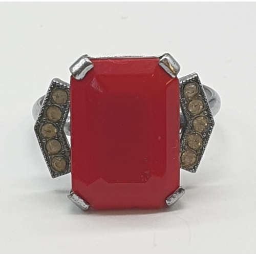 473 - Silver dress ring with red stone. 3g, size M.