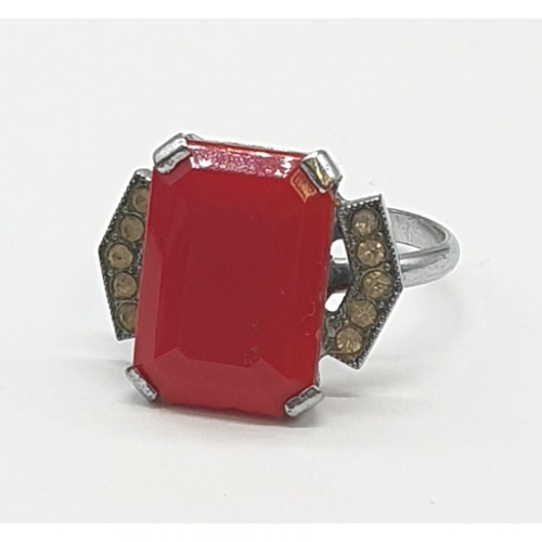 473 - Silver dress ring with red stone. 3g, size M.