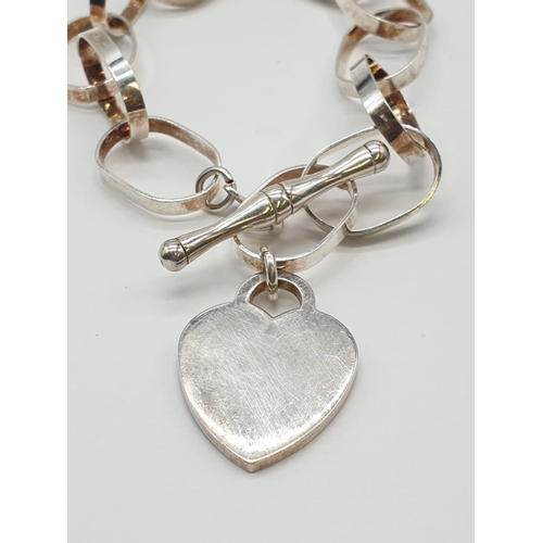 478 - Large link silver bracelet with silver heart. 19g, approx 20cm