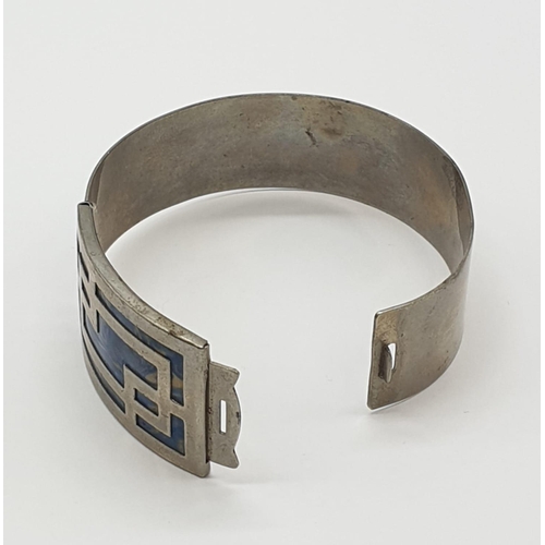 482 - Silver and blue enamel bangle, 22.7g.