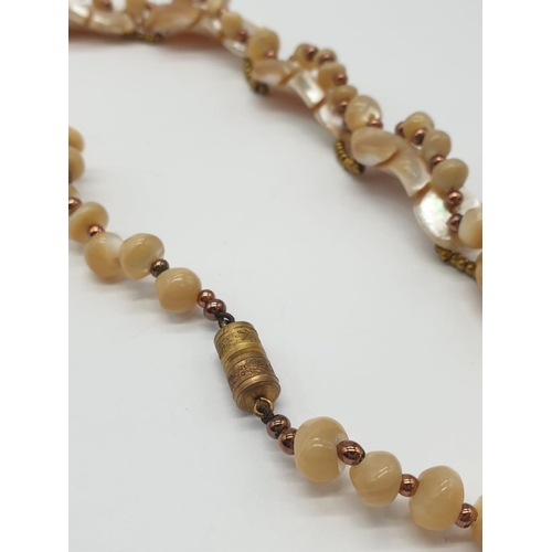 415 - Mother of pearl necklace, 57.8g weight and 34cm long approx