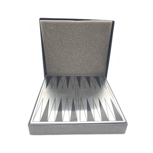 593 - A mini magnetic backgammon board with pieces. 14cm x 14cm.