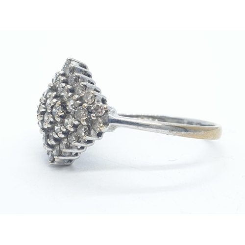 503 - 9ct white gold diamond cluster ring with 1ct of diamonds in total weighs 2.2g size L.