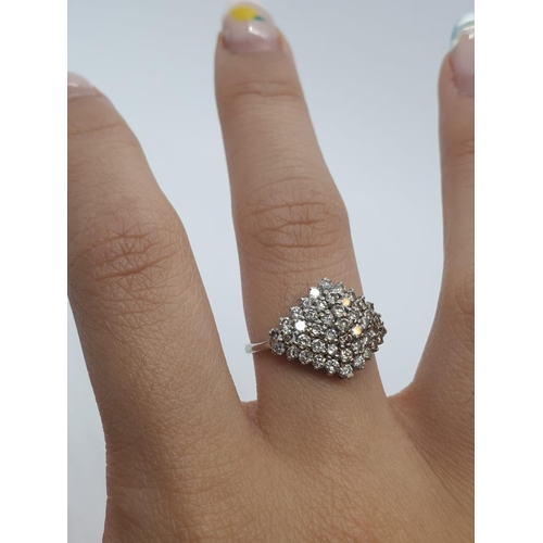 503 - 9ct white gold diamond cluster ring with 1ct of diamonds in total weighs 2.2g size L.