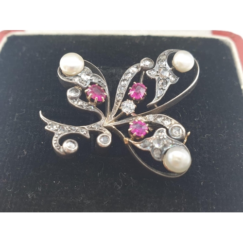 145 - Aspreys diamond and ruby brooch embellished with pearls, weight 7.5g and 35mm long approx