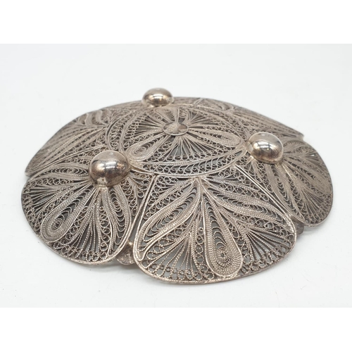 175 - Silver filigree dish. 61.3g in weight. 10cm diameter.