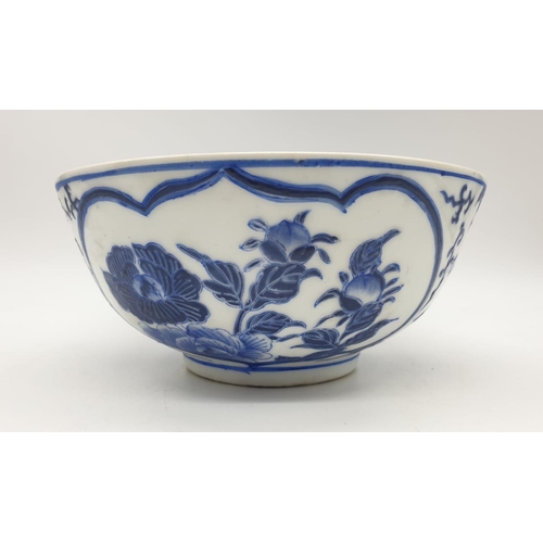 253 - An early Chinese SIGNED porcelain bowl hand painted blue and white floral design, 20cm diameter