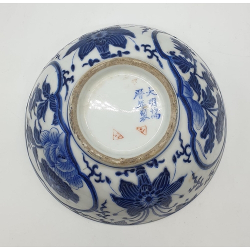 253 - An early Chinese SIGNED porcelain bowl hand painted blue and white floral design, 20cm diameter