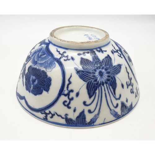 253 - An early Chinese SIGNED porcelain bowl hand painted blue and white floral design, 20cm diameter