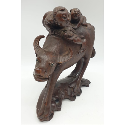 274 - Chinese wooden hand Carved BUFFALLO ridden by father & son, 23cm tall