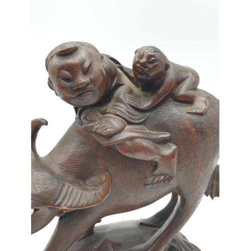 274 - Chinese wooden hand Carved BUFFALLO ridden by father & son, 23cm tall