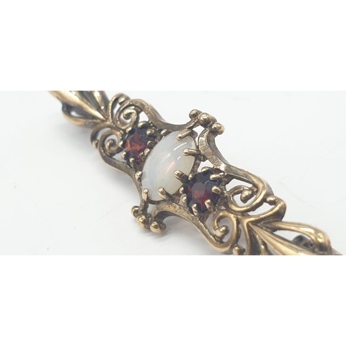 276 - 9ct gold opal and garnet bar brooch, weight 2.5g and 4cm long approx