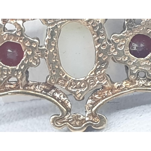 276 - 9ct gold opal and garnet bar brooch, weight 2.5g and 4cm long approx