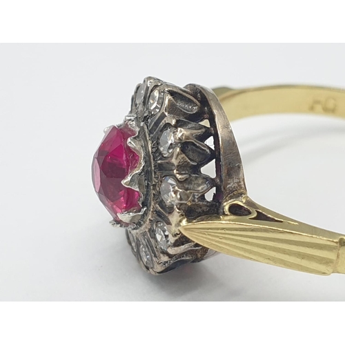 312 - 18k gold ring with ruby centre and diamond surrounding, weight 3.6g, size Q 1/2