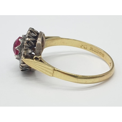 312 - 18k gold ring with ruby centre and diamond surrounding, weight 3.6g, size Q 1/2