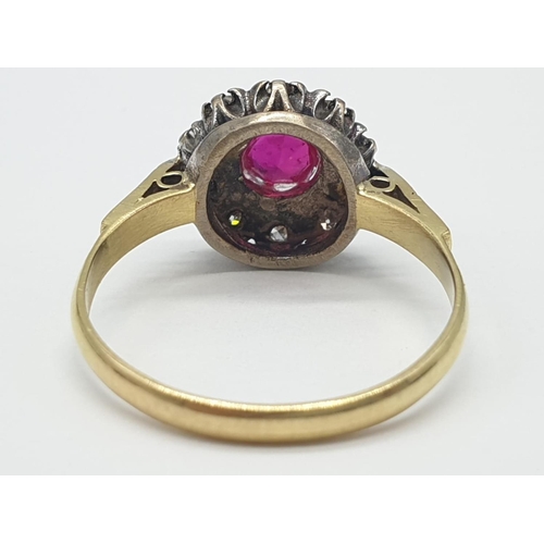 312 - 18k gold ring with ruby centre and diamond surrounding, weight 3.6g, size Q 1/2