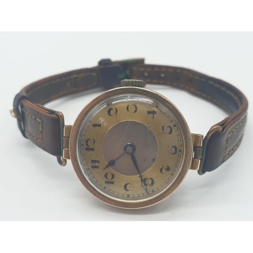 319 - Vintage 9ct gold ladies wrist watch with leather strap