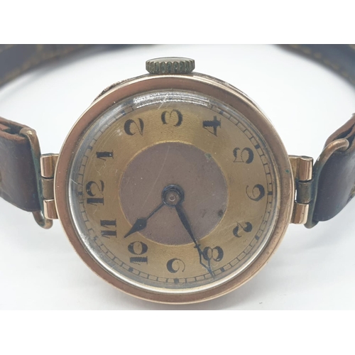 319 - Vintage 9ct gold ladies wrist watch with leather strap