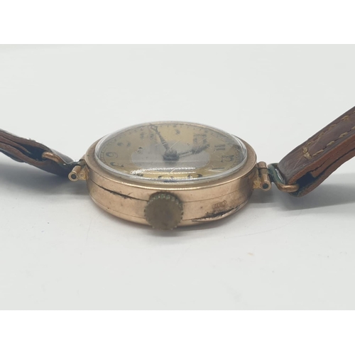 319 - Vintage 9ct gold ladies wrist watch with leather strap