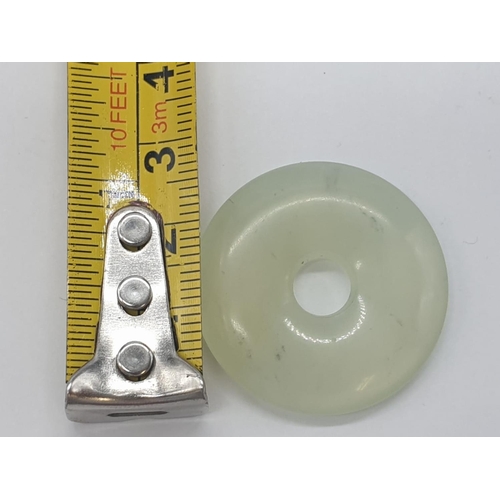 326 - Transparent light jade pendant, weight 7.4g and 3cm diameter