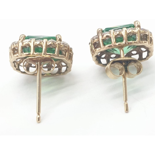 402 - 9ct gold green and white stone earrings, 3.6g