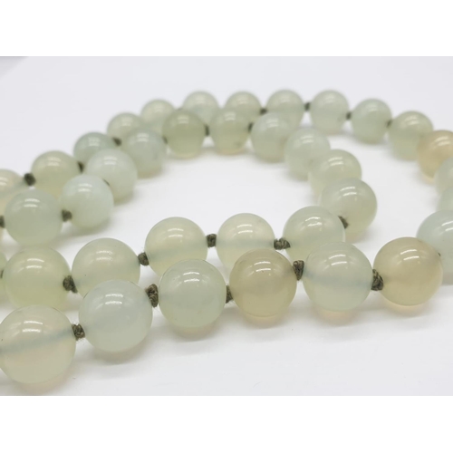 508 - Light transparent jade necklace, weight 117g and 64cm long approx