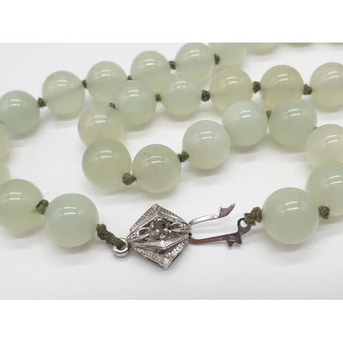 508 - Light transparent jade necklace, weight 117g and 64cm long approx