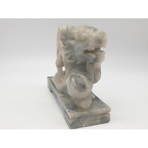 742 - Hand carved dragon ornament on a marble plinth, 13x4x10cm approx