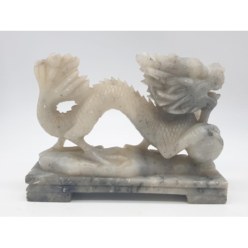 742 - Hand carved dragon ornament on a marble plinth, 13x4x10cm approx