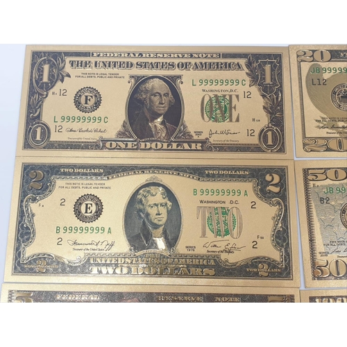 776 - 8x gold plated US dollars assorted denominations