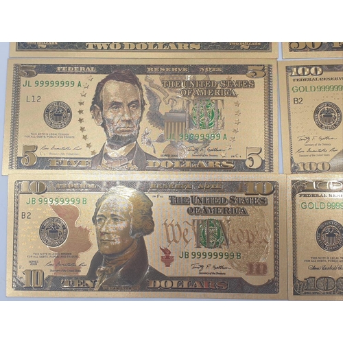 776 - 8x gold plated US dollars assorted denominations